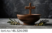 Religion, faith, liturgy, Ash Wednesday. Great lent. A wooden cross, a ceremonial bowl made of ash and an olive branch on a gray background. Стоковое AI-изображение, AI-художник Photojuli / Фотобанк Лори