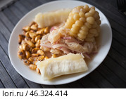 Peruvian traditional dish.fish ceviche with yuka and corn. Стоковое фото, фотограф Татьяна Яцевич / Фотобанк Лори
