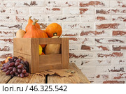 Wooden box with fresh pumpkins, squashes and fruits on table. Стоковое фото, фотограф Pixel_shot / Фотобанк Лори