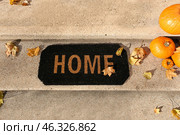 Doormat near entrance of house on autumn day. Стоковое фото, фотограф Pixel_shot / Фотобанк Лори