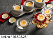 Diya lamp with candles for celebration of Divaly on dark background. Стоковое фото, фотограф Pixel_shot / Фотобанк Лори