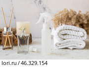 Natural air freshener and essential oil on light background. Стоковое фото, фотограф Pixel_shot / Фотобанк Лори