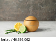 Aroma oil diffuser on grey background. Стоковое фото, фотограф Pixel_shot / Фотобанк Лори