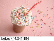 Cup of tasty frappe coffee on color background. Стоковое фото, фотограф Pixel_shot / Фотобанк Лори