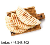 Board with tasty quesadillas on white background. Стоковое фото, фотограф Pixel_shot / Фотобанк Лори