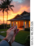 Realtor's hand with keys to house for beach holiday in hot tropics with palm trees. Hotel reservations, booking, moving to new house, mortgage, rent and purchase of real estate. AI generated. Стоковое AI-изображение, AI-художник Ольга Симонова / Фотобанк Лори