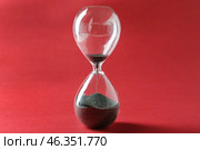 Hourglass on color background. Time management concept. Стоковое фото, фотограф Pixel_shot / Фотобанк Лори