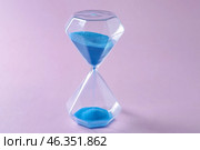 Hourglass on color background. Time management concept. Стоковое фото, фотограф Pixel_shot / Фотобанк Лори