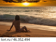 Sunset Tranquility by the Ocean With Waves Gently Lapping at Golden Sands. Стоковое фото, фотограф Aleksandr Golubev / Фотобанк Лори