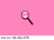 Black mini magnifier on pink background. Стоковое фото, фотограф Pixel_shot / Фотобанк Лори