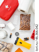 Necessities for emergency bag on white table. Стоковое фото, фотограф Pixel_shot / Фотобанк Лори