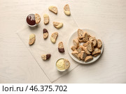 Plate with tasty Italian biscotti and sauces on light table. Стоковое фото, фотограф Pixel_shot / Фотобанк Лори