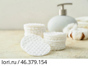 Stacks of cotton pads on light table, closeup. Стоковое фото, фотограф Pixel_shot / Фотобанк Лори