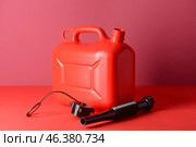 Plastic jerrycan on color background. Стоковое фото, фотограф Pixel_shot / Фотобанк Лори