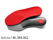 Red orthopedic insoles on white background. Стоковое фото, фотограф Pixel_shot / Фотобанк Лори