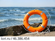 Bright lifebuoy ring on beach. Стоковое фото, фотограф Pixel_shot / Фотобанк Лори