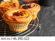 Grid of tasty cruffins with jam on black background. Стоковое фото, фотограф Pixel_shot / Фотобанк Лори