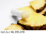 Natural lip balm with pineapple on white background. Стоковое фото, фотограф Pixel_shot / Фотобанк Лори