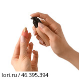 Hands with makeup sponge and concealer on white background. Стоковое фото, фотограф Pixel_shot / Фотобанк Лори
