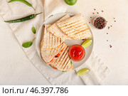 Plate with tasty vegetarian quesadillas, sauce and peppercorns on light background. Стоковое фото, фотограф Pixel_shot / Фотобанк Лори