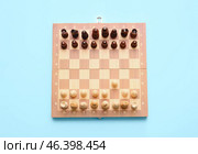 Game board with chess pieces on color background. Стоковое фото, фотограф Pixel_shot / Фотобанк Лори