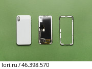 Disassembled mobile phone on color background. Стоковое фото, фотограф Pixel_shot / Фотобанк Лори