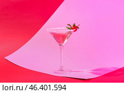 Glass of tasty cosmopolitan cocktail on color background. Стоковое фото, фотограф Pixel_shot / Фотобанк Лори