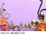 Tibetan singing bowl, karatalas, bracelets and flowers on color background. Стоковое фото, фотограф Pixel_shot / Фотобанк Лори