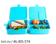 Lunchboxes with yummy food isolated on white background. Стоковое фото, фотограф Pixel_shot / Фотобанк Лори