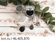 Different cosmetic clays on white wooden table. Стоковое фото, фотограф Pixel_shot / Фотобанк Лори