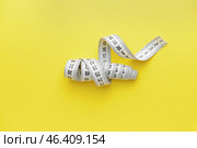 Measuring tape on color background. Стоковое фото, фотограф Pixel_shot / Фотобанк Лори