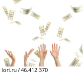 Female hands with falling dollar banknotes on white background. Стоковое фото, фотограф Pixel_shot / Фотобанк Лори