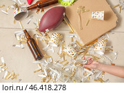 Unconscious woman lying on floor with terrible mess after New Year party. Стоковое фото, фотограф Pixel_shot / Фотобанк Лори