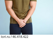 Young man with urologic disease on light background. Стоковое фото, фотограф Pixel_shot / Фотобанк Лори