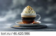 Delightful coffee treat with whipped cream and a sprinkle of spice served in a cozy cafe setting. Стоковое AI-изображение, AI-художник Сергей Толмачёв / Фотобанк Лори