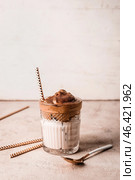 Glass of tasty dalgona coffee on light background. Стоковое фото, фотограф Pixel_shot / Фотобанк Лори