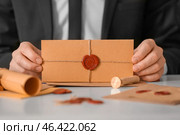 Notary public with envelope in office, closeup. Стоковое фото, фотограф Pixel_shot / Фотобанк Лори