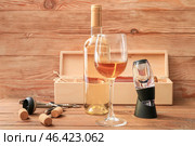 Wine aerator with bottle and glass on wooden background. Стоковое фото, фотограф Pixel_shot / Фотобанк Лори