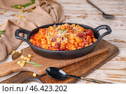 Dish with tasty pasta and beans on table. Стоковое фото, фотограф Pixel_shot / Фотобанк Лори