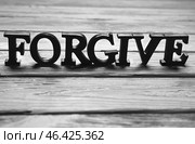 Word FORGIVE on wooden background. Стоковое фото, фотограф Pixel_shot / Фотобанк Лори