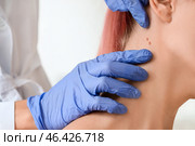 Dermatologist examining patient in clinic, closeup. Стоковое фото, фотограф Pixel_shot / Фотобанк Лори