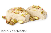 Pieces of tasty Tahini halva with pistachios on white background. Стоковое фото, фотограф Pixel_shot / Фотобанк Лори
