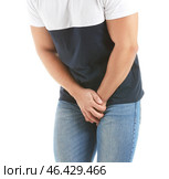 Young man with urologic disease on white background. Стоковое фото, фотограф Pixel_shot / Фотобанк Лори