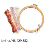 Embroidery hoop with mouline threads and needles isolated on white background. Стоковое фото, фотограф Pixel_shot / Фотобанк Лори