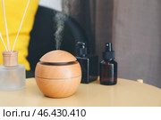 Aroma oil diffuser on table in room. Стоковое фото, фотограф Pixel_shot / Фотобанк Лори
