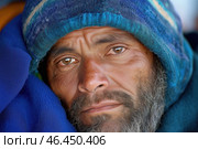 Portrait of an adult houseless man in a blue hat. Стоковое AI-изображение, AI-художник Евгений Харитонов / Фотобанк Лори