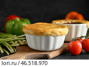 Вкусные пирожки с овощами на черном фоне. Стоковое фото, фотограф Pixel_shot / Фотобанк Лори