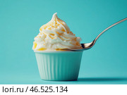 A spoon is in a white cup of ice cream. Стоковое AI-изображение, AI-художник Ярославский Максим / Фотобанк Лори