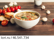 Тарелка вкусного чечевичного супа на столе. Стоковое фото, фотограф Pixel_shot / Фотобанк Лори