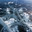 Winter landscape of frozen Baikal Lake in cold winter day. Natural seasonal background with blue ice cover with white bubbles and cracks. Winter travels and outdoors. Стоковое фото, фотограф Виктория Катьянова / Фотобанк Лори